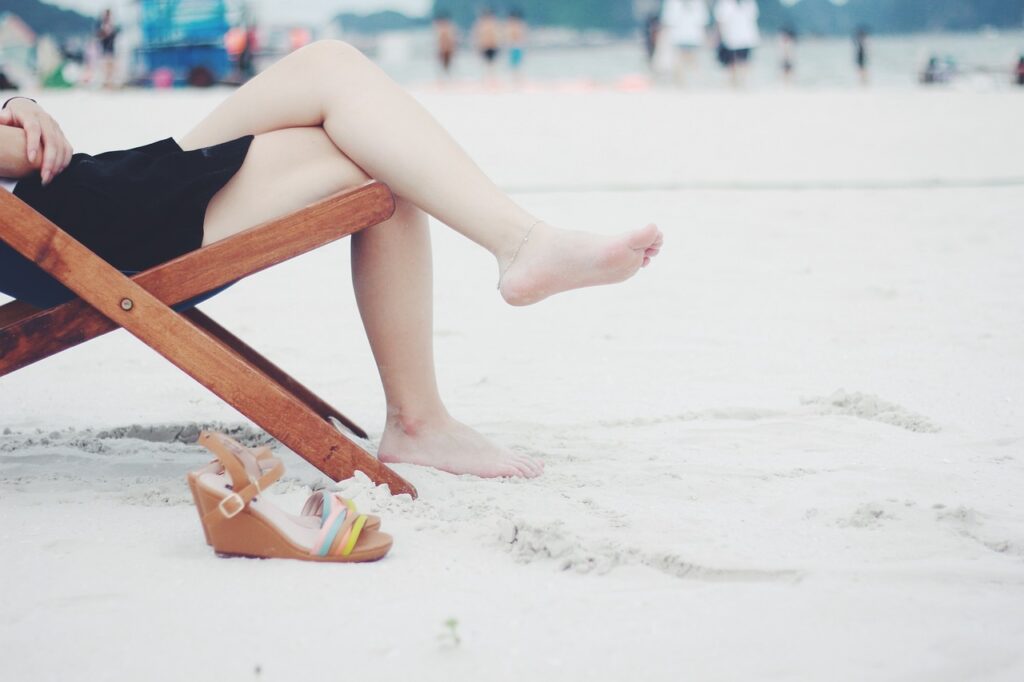 woman, beach, beach chair, feet, female, barefoot, nature, girl, lady, legs, leisure, outdoors, recreation, relaxation, resort, resting, sand, sandals, sitting, wooden chair, sandy beach, shore, seashore